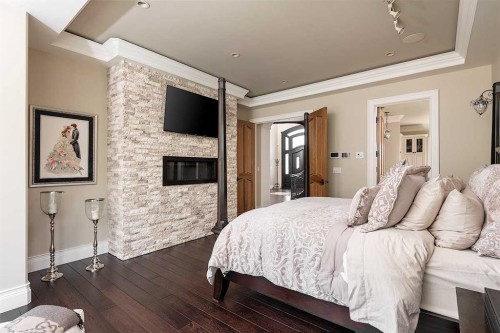 8018 Willow Grove Way, Rural Grande Prairie No. 1, County Of, AB - Indoor Photo Showing Bedroom With Fireplace