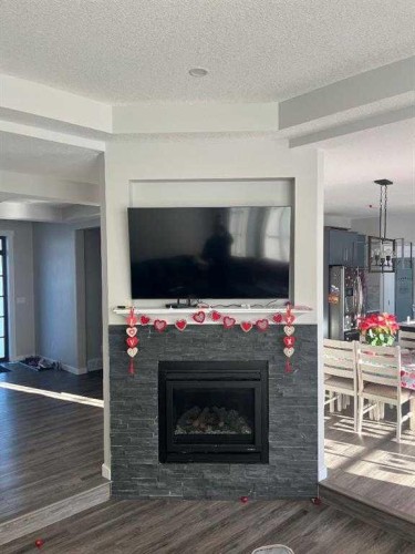 11-1049 Alberta Avenue, Debolt, AB - Indoor Photo Showing Living Room With Fireplace