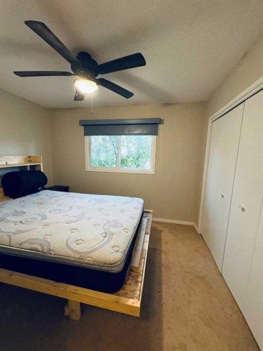 7421 98B Street, Peace River, AB - Indoor Photo Showing Bedroom