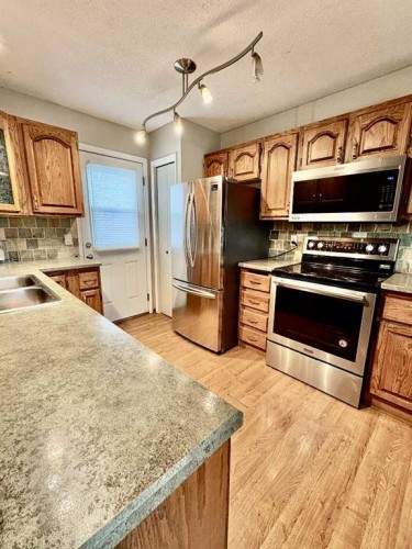 7421 98B Street, Peace River, AB - Indoor Photo Showing Kitchen With Double Sink