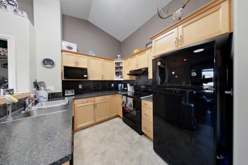 12026 102A Street, Grande Prairie, AB - Indoor Photo Showing Kitchen With Double Sink