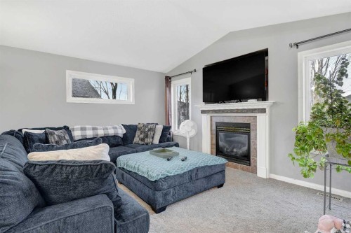 6938 115 Street, Grande Prairie, AB - Indoor Photo Showing Living Room With Fireplace