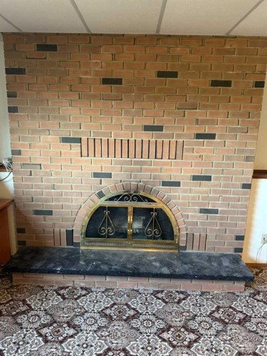 7305 96 Street, Peace River, AB - Indoor Photo Showing Other Room With Fireplace