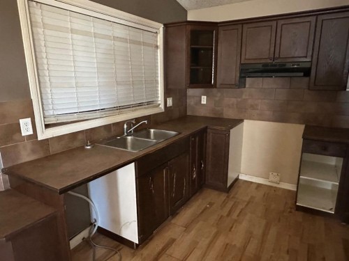 9006 94A Avenue, Grande Prairie, AB - Indoor Photo Showing Kitchen With Double Sink