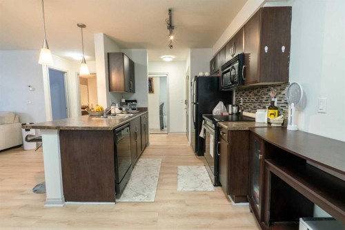 401-9120 96 Avenue, Grande Prairie, AB - Indoor Photo Showing Kitchen With Double Sink With Upgraded Kitchen