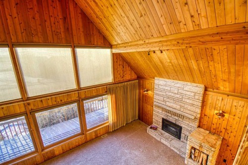 745 Cedar Street, Beaverlodge, AB - Indoor Photo Showing Other Room With Fireplace