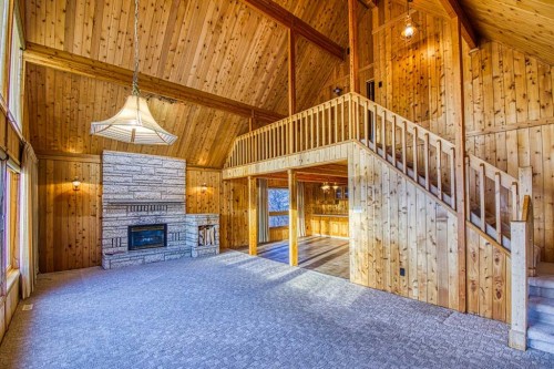 745 Cedar Street, Beaverlodge, AB - Indoor Photo Showing Other Room With Fireplace