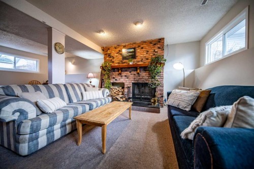 11822 96 Street, Grande Prairie, AB - Indoor Photo Showing Living Room With Fireplace