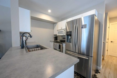 7204 105 Street, Grande Prairie, AB - Indoor Photo Showing Kitchen With Stainless Steel Kitchen