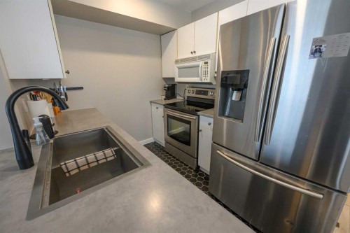 7204 105 Street, Grande Prairie, AB - Indoor Photo Showing Kitchen With Stainless Steel Kitchen