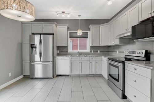 9413 88A Street, Grande Prairie, AB - Indoor Photo Showing Kitchen With Stainless Steel Kitchen With Upgraded Kitchen