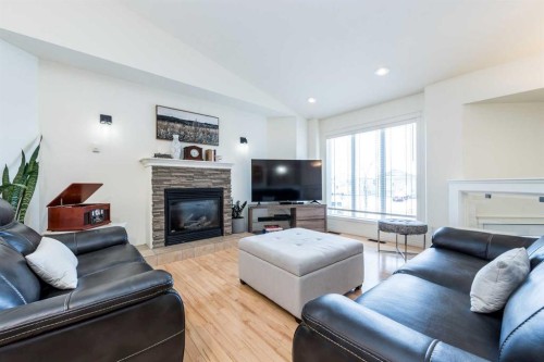 8905 Lakeland Drive, Grande Prairie, AB - Indoor Photo Showing Living Room With Fireplace