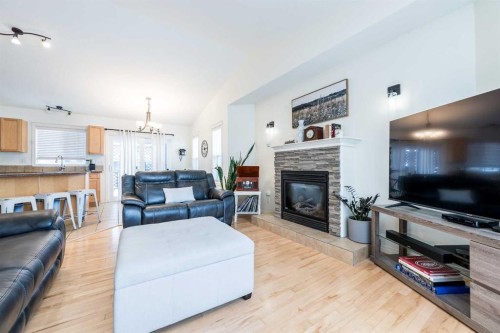 8905 Lakeland Drive, Grande Prairie, AB - Indoor Photo Showing Living Room With Fireplace