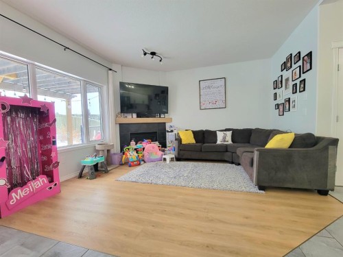 10242 85A Street, Grande Prairie, AB - Indoor Photo Showing Living Room With Fireplace