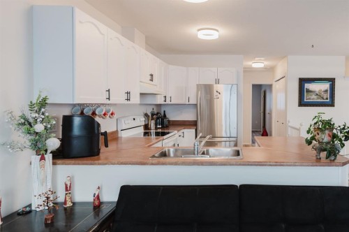 B-9700 95 Avenue, Sexsmith, AB - Indoor Photo Showing Kitchen With Double Sink