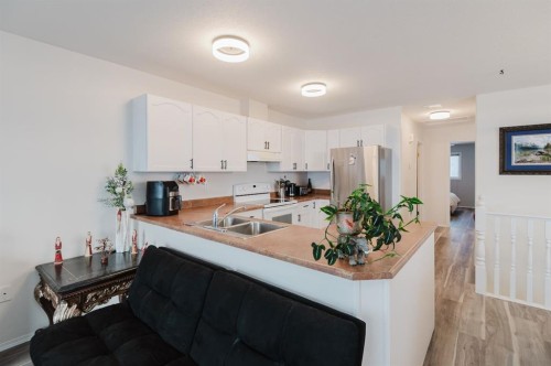 B-9700 95 Avenue, Sexsmith, AB - Indoor Photo Showing Kitchen With Double Sink