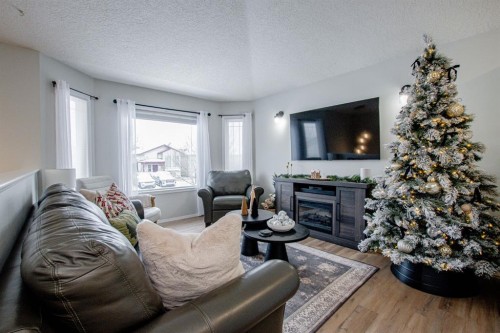 8825 65 Avenue, Grande Prairie, AB - Indoor Photo Showing Living Room With Fireplace