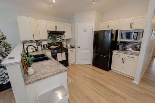8825 65 Avenue, Grande Prairie, AB - Indoor Photo Showing Kitchen With Double Sink