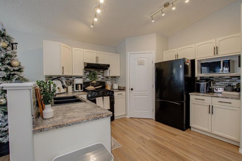 8825 65 Avenue, Grande Prairie, AB - Indoor Photo Showing Kitchen With Double Sink