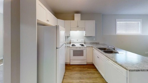 9503 112 Avenue, Clairmont, AB - Indoor Photo Showing Kitchen With Double Sink