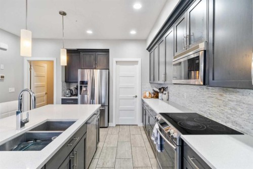 11329 Tamarack Drive, Grande Prairie, AB - Indoor Photo Showing Kitchen With Double Sink With Upgraded Kitchen