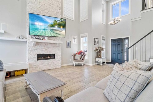11329 Tamarack Drive, Grande Prairie, AB - Indoor Photo Showing Living Room With Fireplace