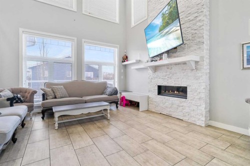11329 Tamarack Drive, Grande Prairie, AB - Indoor Photo Showing Living Room With Fireplace