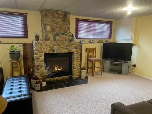 11500 105 Avenue, Fairview, AB - Indoor Photo Showing Living Room With Fireplace