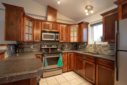 2 Black Spruce Drive, High Level, AB - Indoor Photo Showing Kitchen With Double Sink