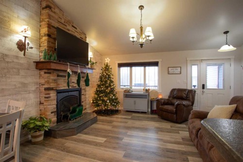 2 Black Spruce Drive, High Level, AB - Indoor Photo Showing Living Room With Fireplace