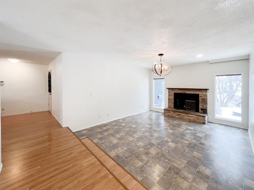 9423 125 Avenue, Grande Prairie, AB - Indoor Photo Showing Living Room With Fireplace