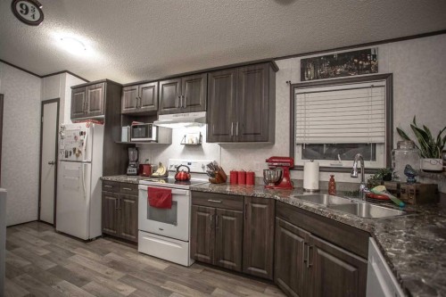 17 Driftwood Drive, High Level, AB - Indoor Photo Showing Kitchen With Double Sink