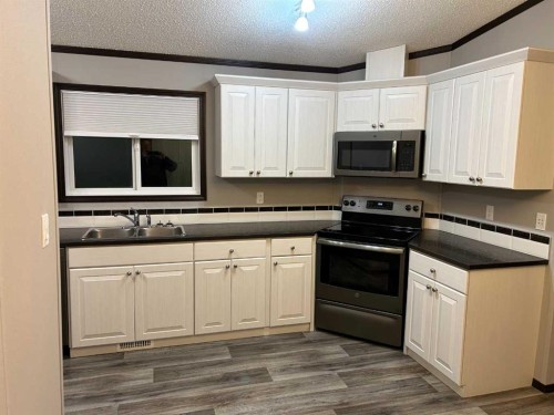 19 4 Street West, Faust, AB - Indoor Photo Showing Kitchen With Double Sink