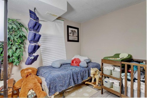 9809 98 Avenue, Sexsmith, AB - Indoor Photo Showing Bedroom