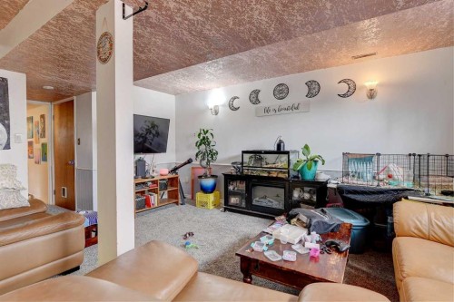 9809 98 Avenue, Sexsmith, AB - Indoor Photo Showing Living Room With Fireplace
