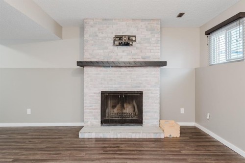 9713 75 Avenue, Grande Prairie, AB - Indoor Photo Showing Living Room With Fireplace