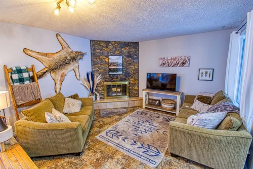 1122 6 Ave West, Beaverlodge, AB - Indoor Photo Showing Living Room With Fireplace