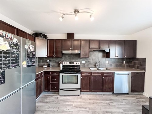 11218 Pinnacle Drive, Grande Prairie, AB - Indoor Photo Showing Kitchen With Stainless Steel Kitchen With Double Sink