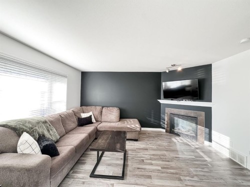 11218 Pinnacle Drive, Grande Prairie, AB - Indoor Photo Showing Living Room With Fireplace