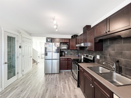 11218 Pinnacle Drive, Grande Prairie, AB - Indoor Photo Showing Kitchen With Stainless Steel Kitchen With Double Sink
