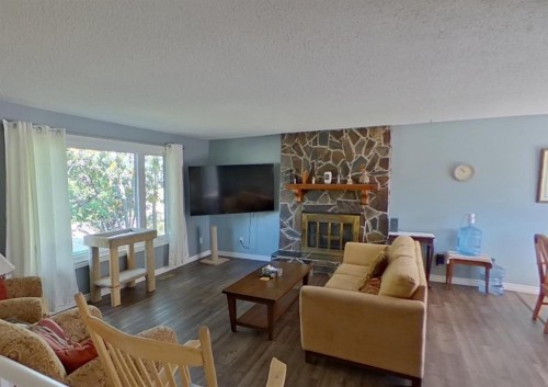 5415 46 Street, Valleyview, AB - Indoor Photo Showing Living Room With Fireplace