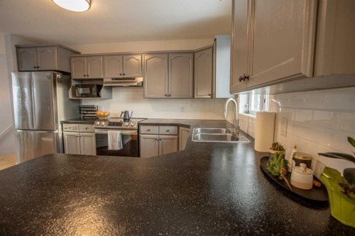 23 Beaver Ranch Drive, High Level, AB - Indoor Photo Showing Kitchen With Stainless Steel Kitchen With Double Sink