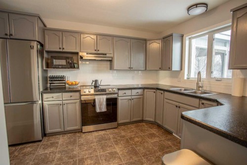 23 Beaver Ranch Drive, High Level, AB - Indoor Photo Showing Kitchen With Stainless Steel Kitchen With Double Sink