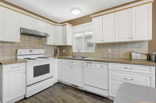 12129 94A Street, Grande Prairie, AB - Indoor Photo Showing Kitchen With Double Sink