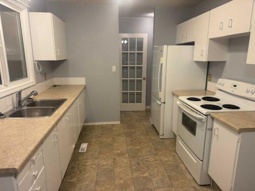 4317 54 Street, Grimshaw, AB - Indoor Photo Showing Kitchen With Double Sink