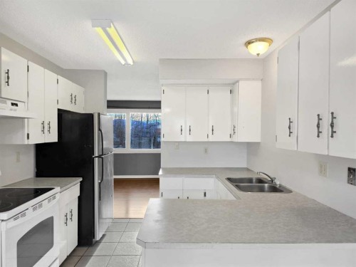 46 97 Avenue, Grande Cache, AB - Indoor Photo Showing Kitchen With Double Sink