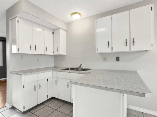 46 97 Avenue, Grande Cache, AB - Indoor Photo Showing Kitchen With Double Sink