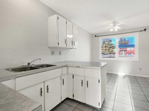 46 97 Avenue, Grande Cache, AB - Indoor Photo Showing Kitchen With Double Sink