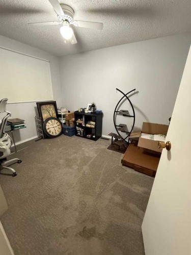 10402 101 Street, High Level, AB - Indoor Photo Showing Gym Room