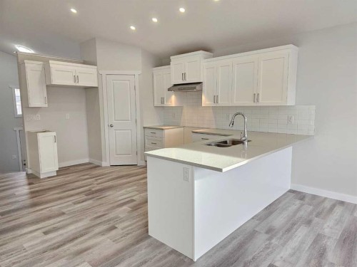 9211 94A Avenue, Wembley, AB - Indoor Photo Showing Kitchen With Double Sink